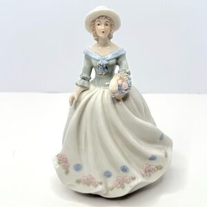 Vintage Porcelain Lady Holding a Flower Basket Figurine